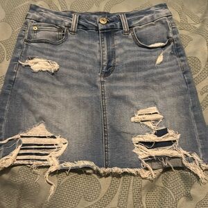 A Demi American Eagle skirt with holes that are covered with inside Demi